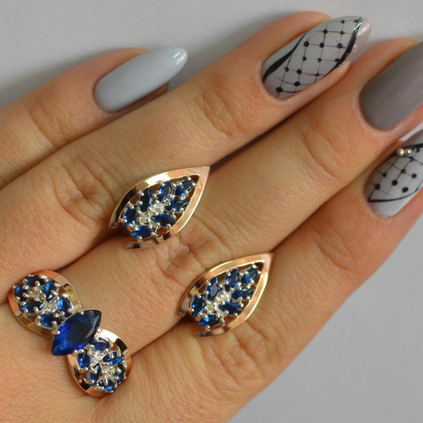 Срібний набір з золотими пластинами