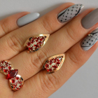 Срібний набір з золотими пластинами