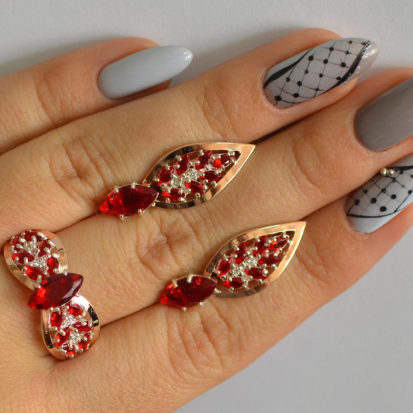 Срібний набір з золотими пластинами