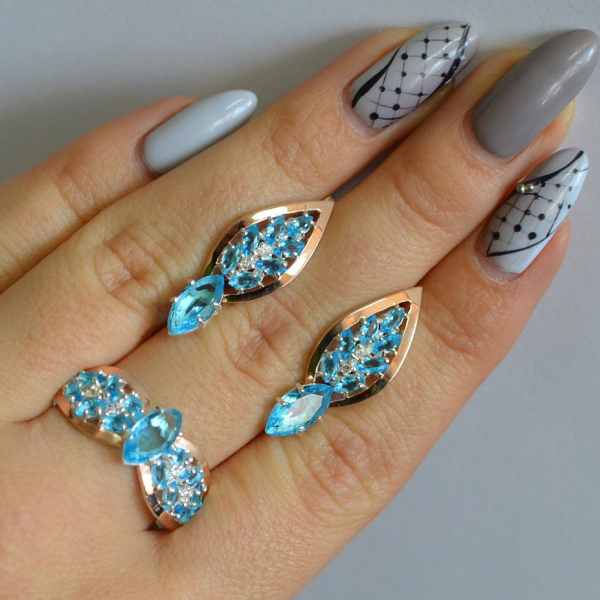 Срібний набір з золотими пластинами