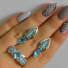 Срібний набір з золотими пластинами