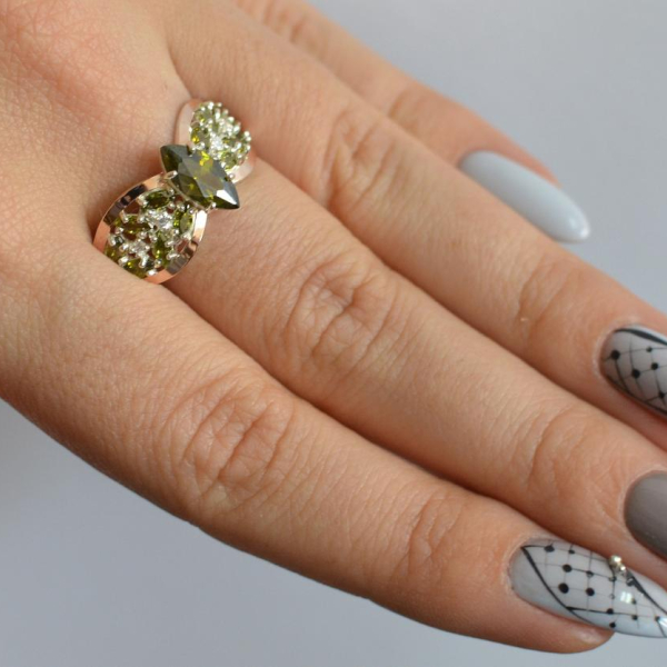 Срібна каблучка з золотими вставками