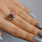 Срібна каблучка з золотими вставками