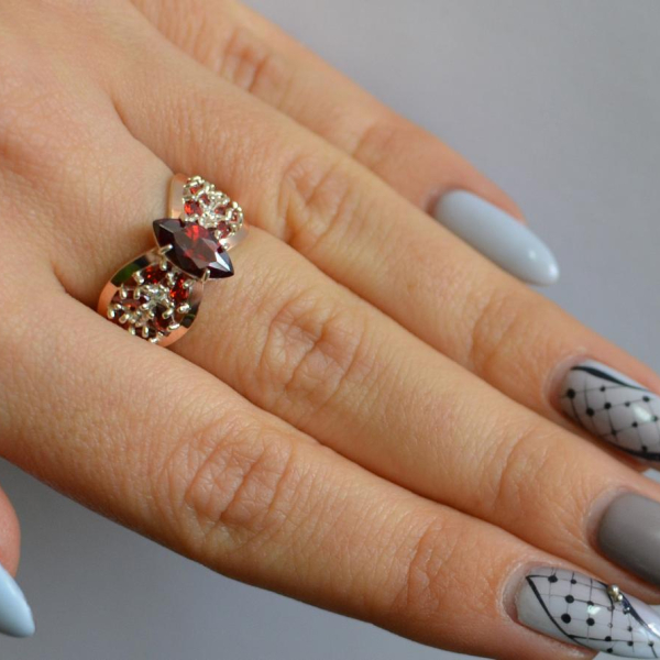 Срібна каблучка з золотими вставками