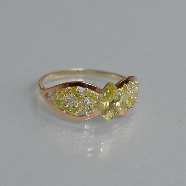 Срібна каблучка з золотими вставками