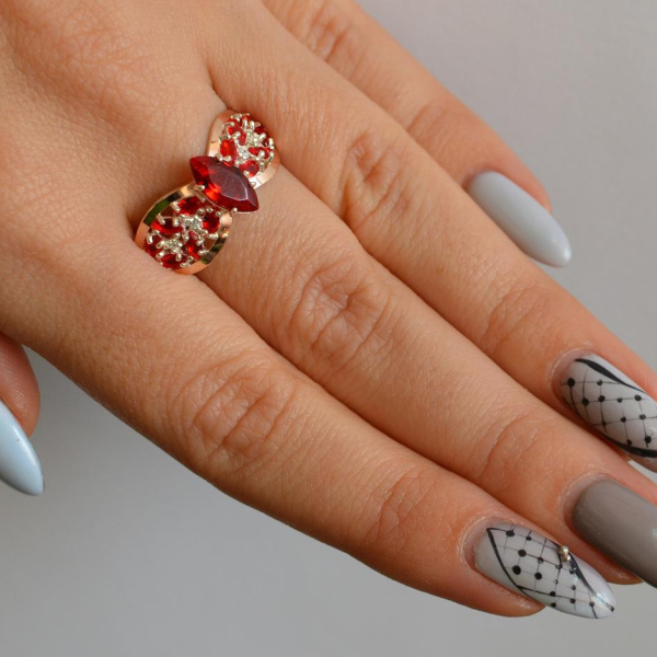 Срібна каблучка з золотими вставками