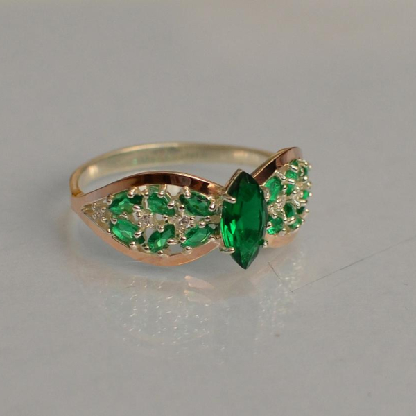 Срібна каблучка з золотими вставками