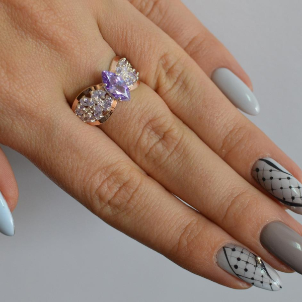 Срібна каблучка з золотими вставками