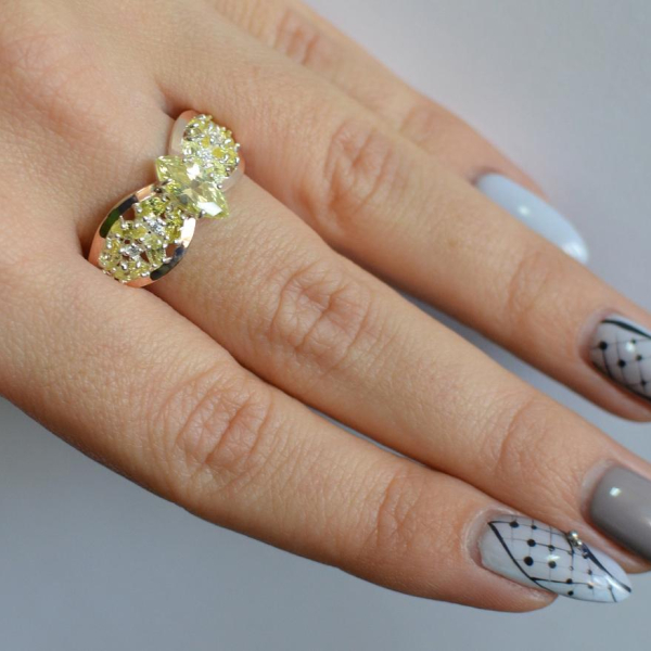 Срібна каблучка з золотими вставками