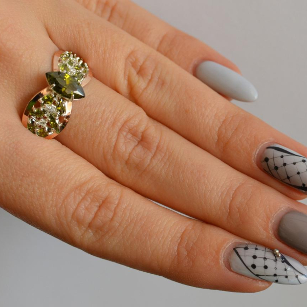 Срібна каблучка з золотими вставками