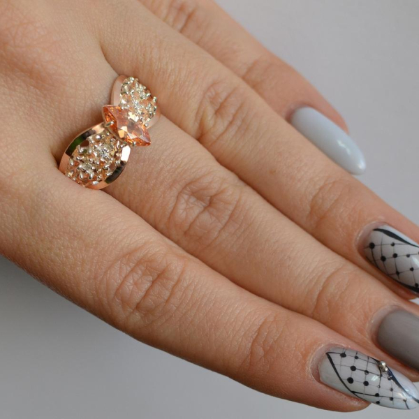 Срібна каблучка з золотими вставками