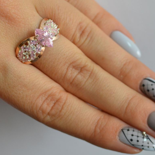 Срібна каблучка з золотими вставками