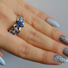 Срібна каблучка з золотими вставками