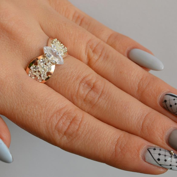 Срібна каблучка з золотими вставками