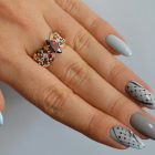 Срібна каблучка з золотими вставками