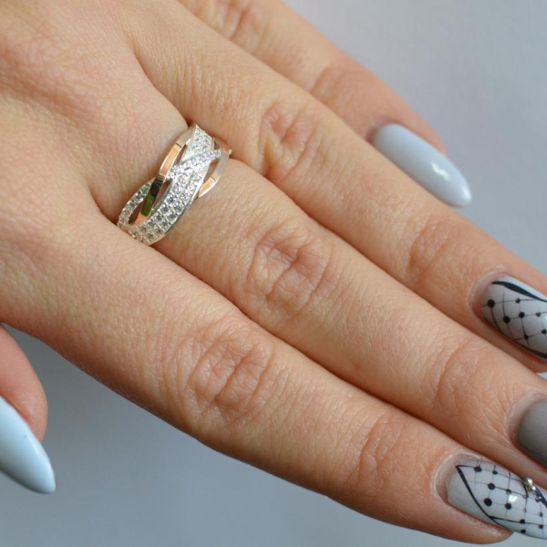 Срібна каблучка з золотими вставками