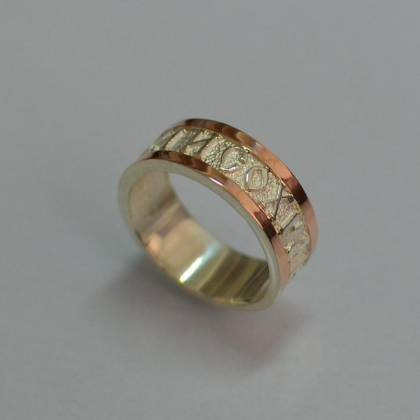 Срібна каблучка з золотими вставками