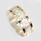 Срібна каблучка з золотими вставками