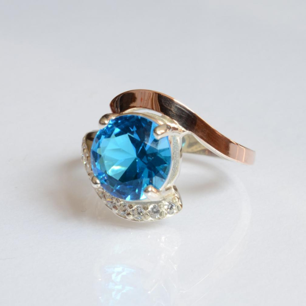 Срібна каблучка з золотими вставками