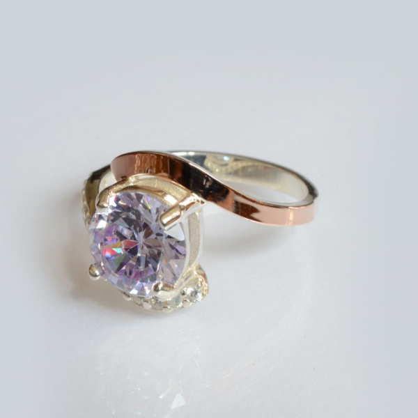 Срібна каблучка з золотими вставками