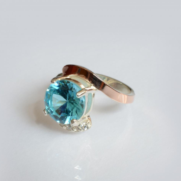 Срібна каблучка з золотими вставками