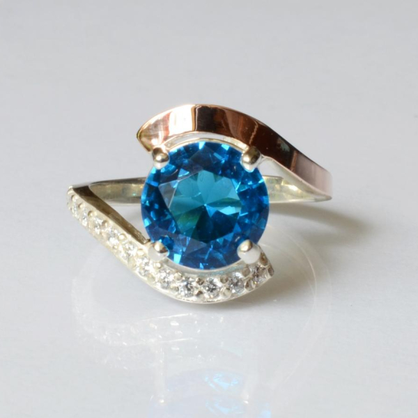 Срібна каблучка з золотими вставками