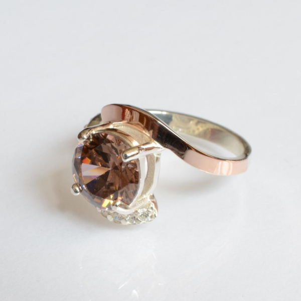 Срібна каблучка з золотими вставками