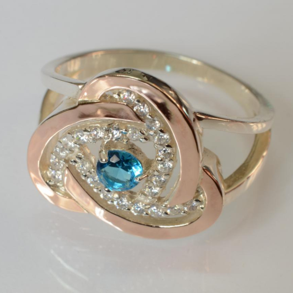 Срібна каблучка з золотими вставками