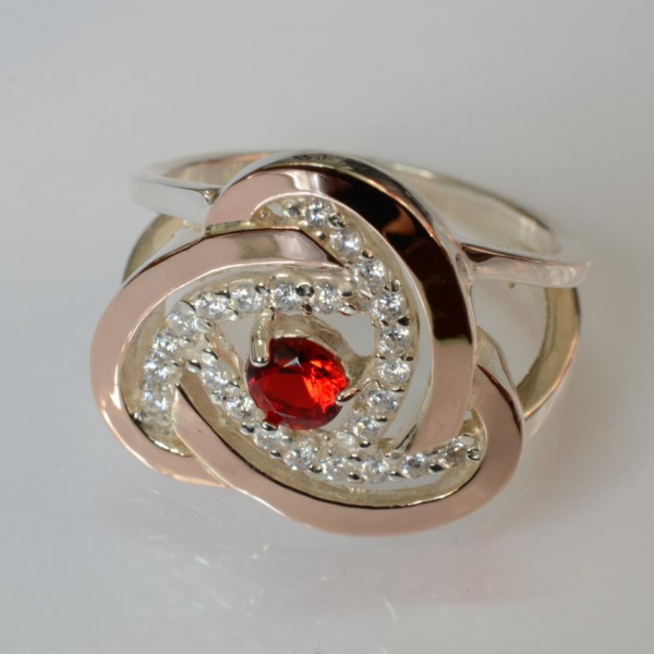 Срібна каблучка з золотими вставками