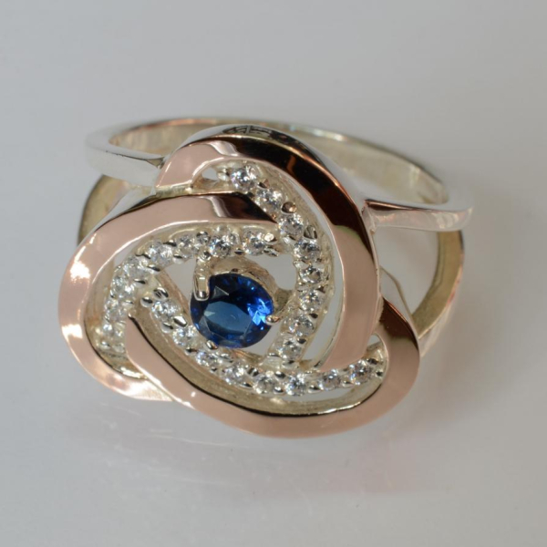 Срібна каблучка з золотими вставками