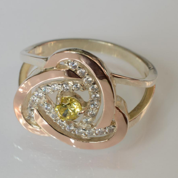 Срібна каблучка з золотими вставками