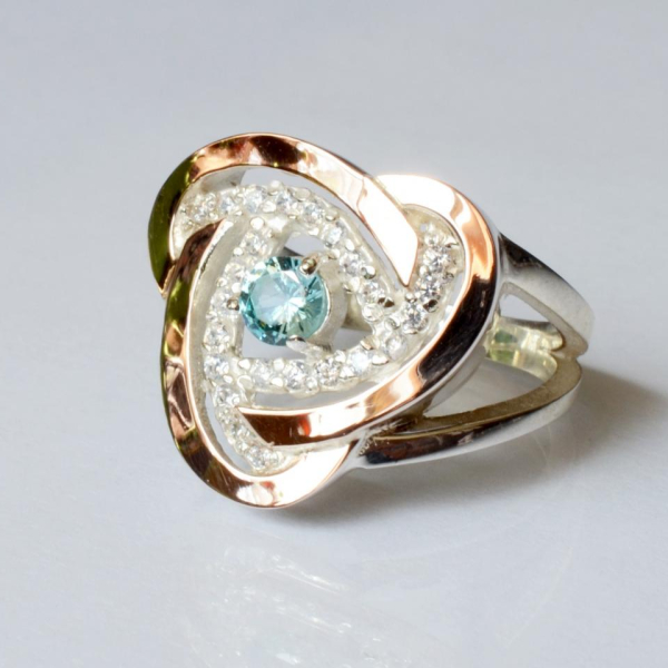 Срібна каблучка з золотими вставками