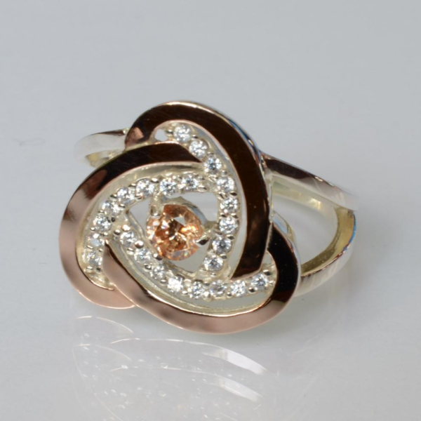 Срібна каблучка з золотими вставками