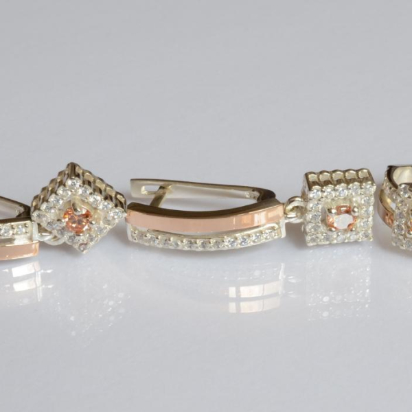 Срібний набір з золотими пластинами