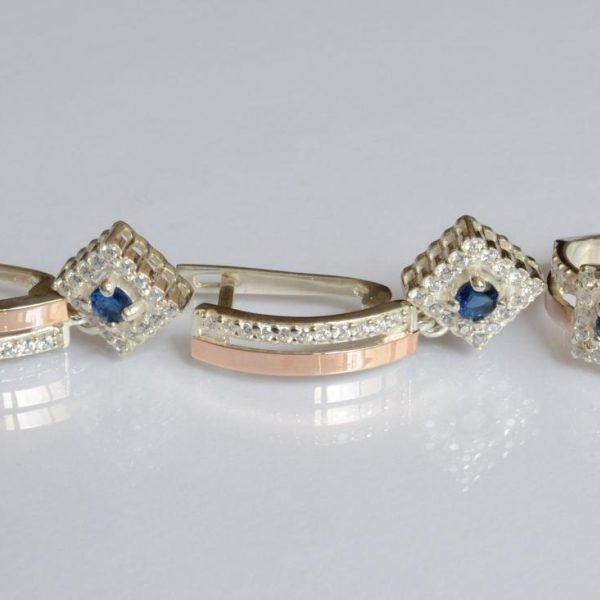 Срібний набір з золотими пластинами