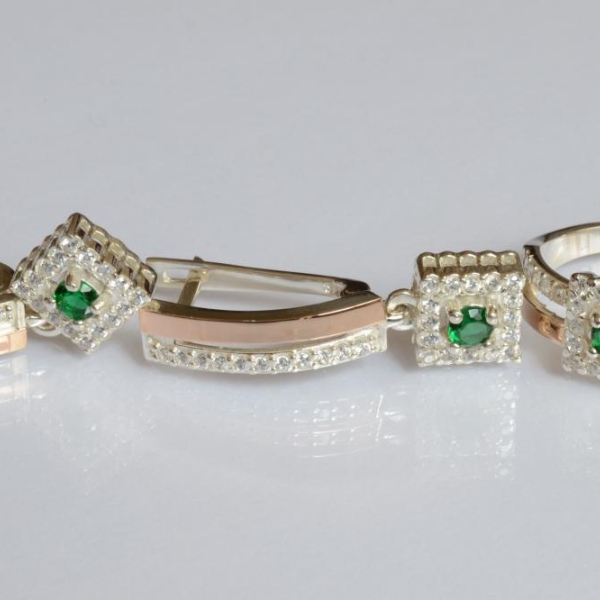 Срібний набір з золотими пластинами