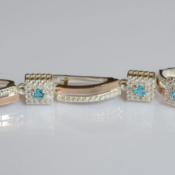 Срібний набір з золотими пластинами