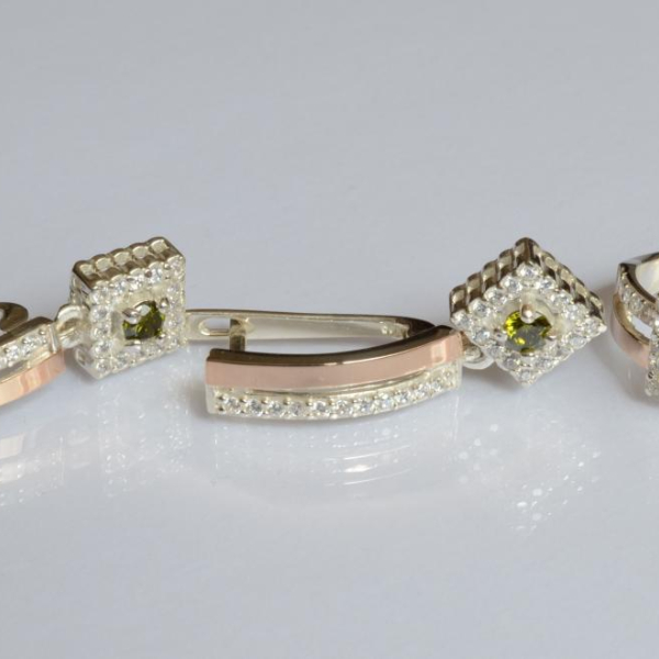 Срібний набір з золотими пластинами