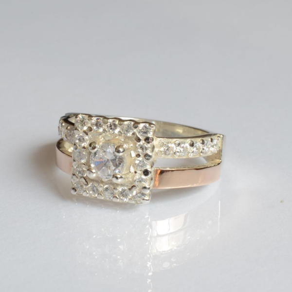 Срібна каблучка з золотими вставками