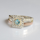 Срібна каблучка з золотими вставками