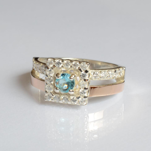 Срібна каблучка з золотими вставками