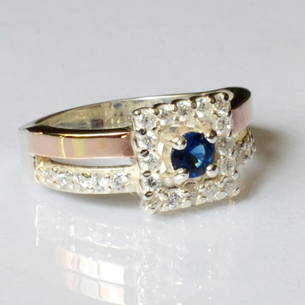 Срібна каблучка з золотими вставками