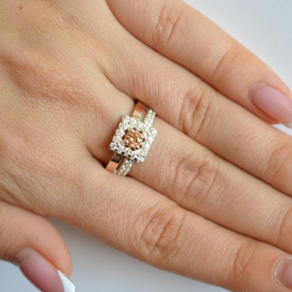 Срібна каблучка з золотими вставками