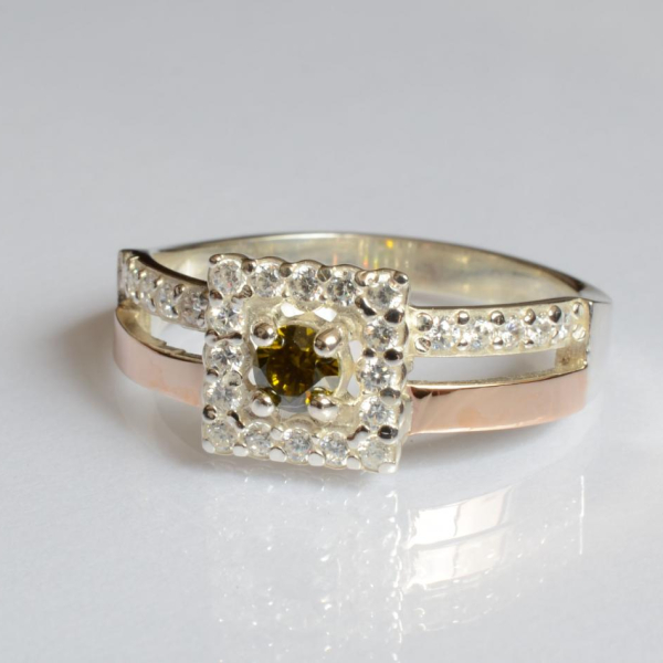 Срібна каблучка з золотими вставками