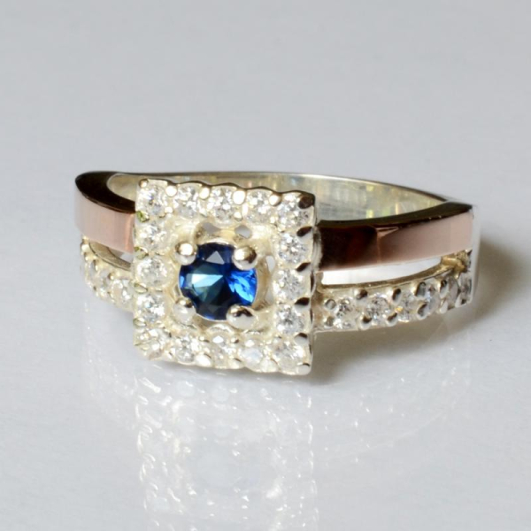 Срібна каблучка з золотими вставками