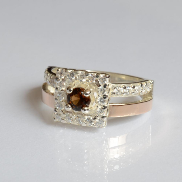 Срібна каблучка з золотими вставками