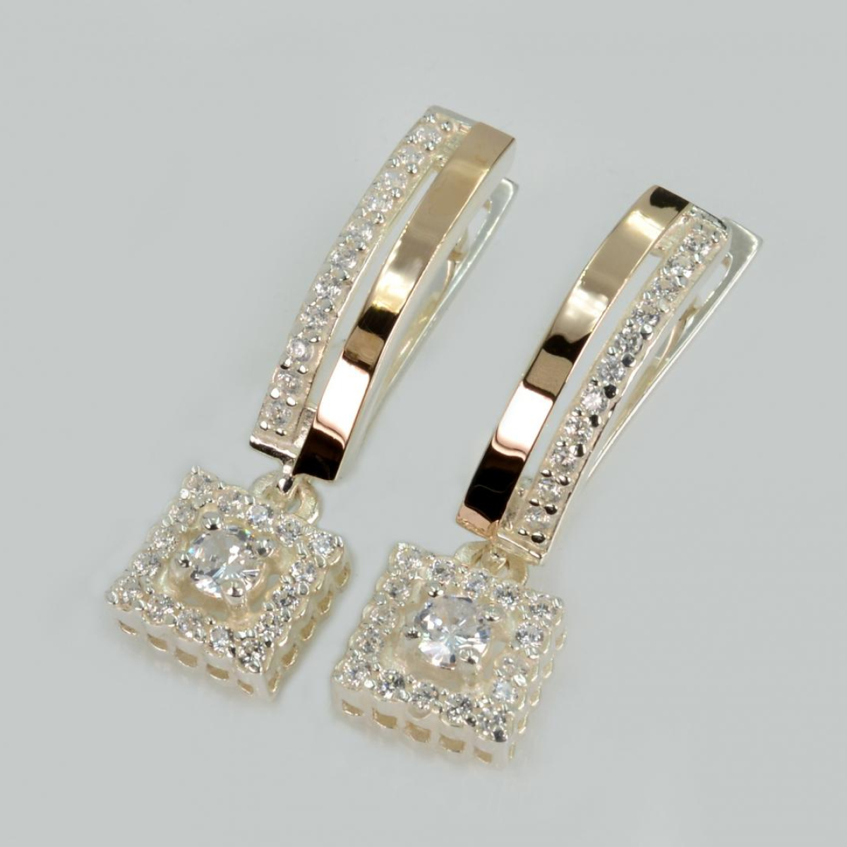 Срібні сережки з золотими пластинами