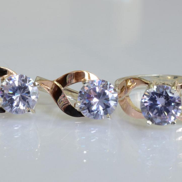 Срібний набір з золотими пластинами