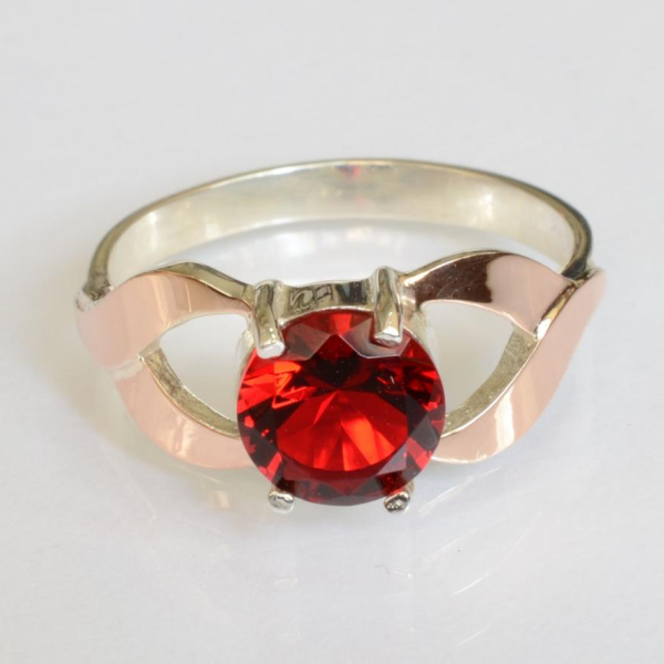 Срібна каблучка з золотими вставками