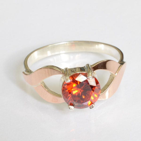 Срібна каблучка з золотими вставками